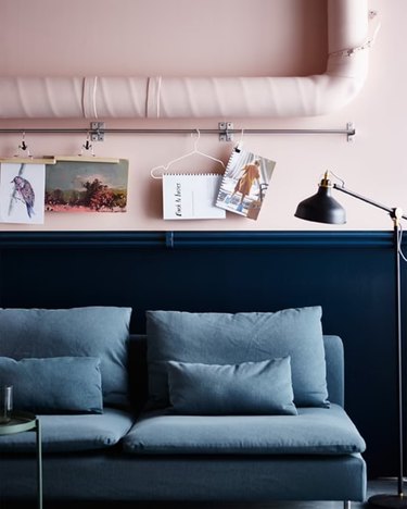 bedroom with light pink wall and blue bed