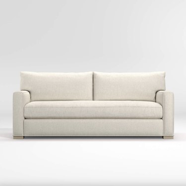 Crate and Barrel Axis bench sofa in white against a white backdrop