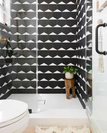 black and white bathroom with graphic shower tile