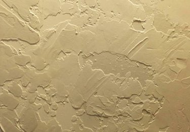 A close-up of skip trowel ceiling texture