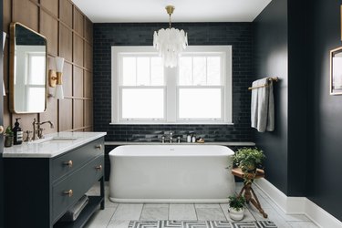 black and white bathroom with wood wall paneling
