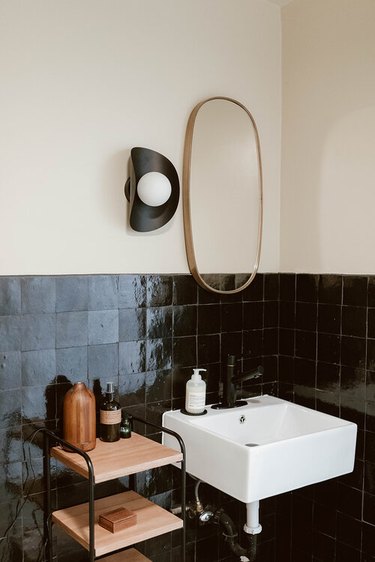 black and white bathroom with zellige wall tile