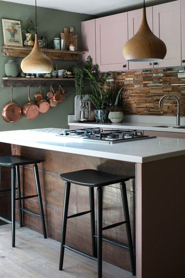 Olive green kitchen with dusty pink cabinets