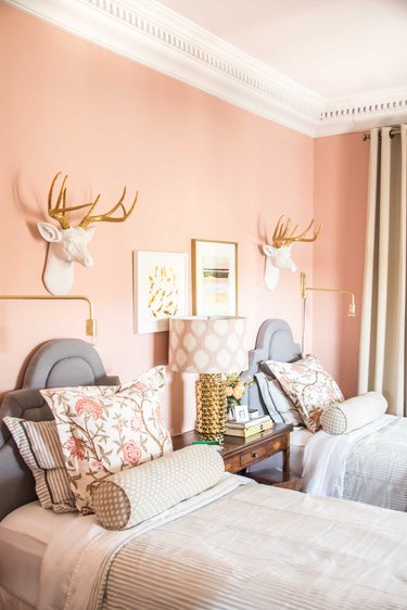 Pink peach painted bedroom with gold accents