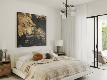 White painted bedroom with gold accents