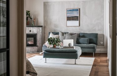 Room with textured gray accent wall against lighter gray walls