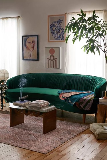 curved green velvet couch