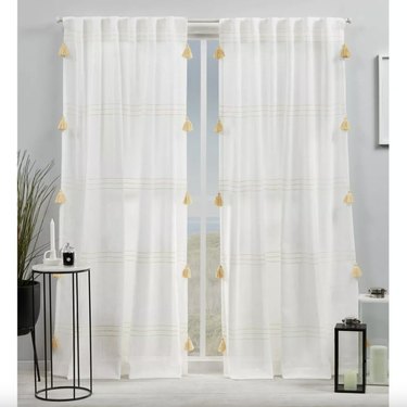 semisheer white curtains with yellow tassels
