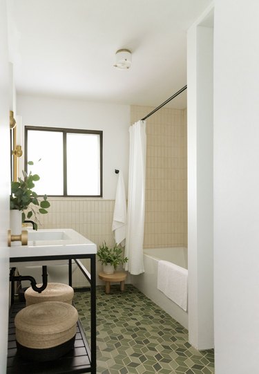 modern green tile floor and cream tile wall in bathroom
