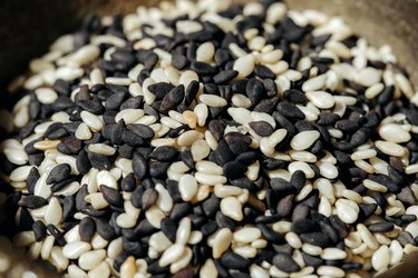black and white sesame seeds in pile