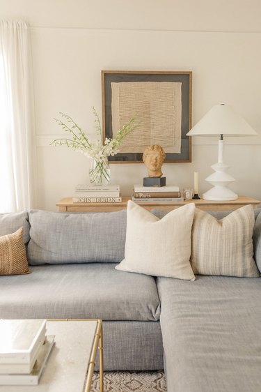 cream living room with light gray sofa