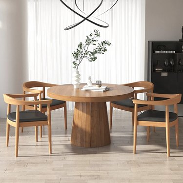 Round pedestal wood dining table