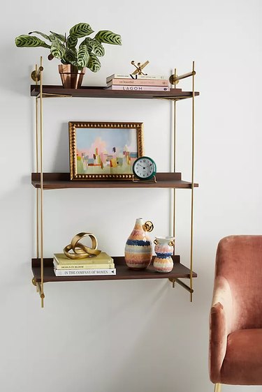 wall mounted shelf near chair
