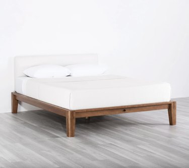 bed on walnut bed frame