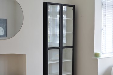 Bookcase with glass doors painted black