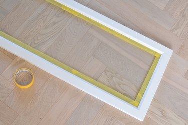 Taping edges of glass on cabinet doors