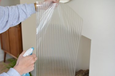 Spraying reeded glass window film