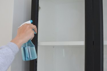 Spraying doors with window solution