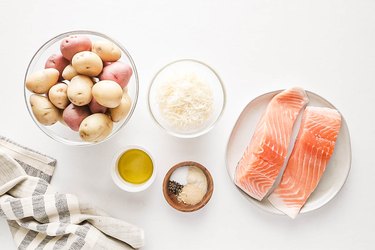 Ingredients for baked salmon and crispy Parmesan potatoes