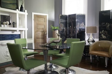 dining room with round table and green chairs