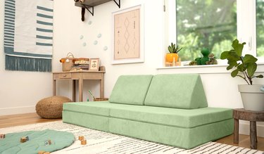 green kids' couch in nursery