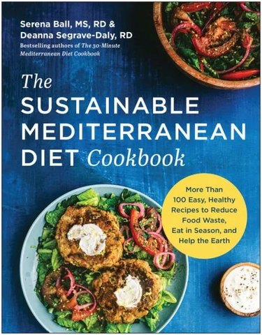 Book cover of "The Sustainable Mediterranean Diet Cookbook" featuring plates of Mediterranean cuisine on a blue surface.