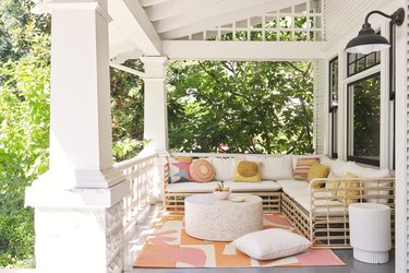 relaxing front porch with outdoor sectional and area rug