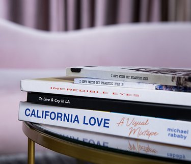 Stack of publications on a coffee table in Monica Orozco's living room