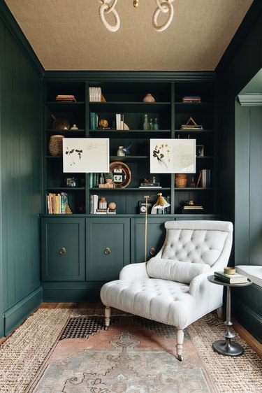 forest green cabinets and walls with tan ceiling and rug