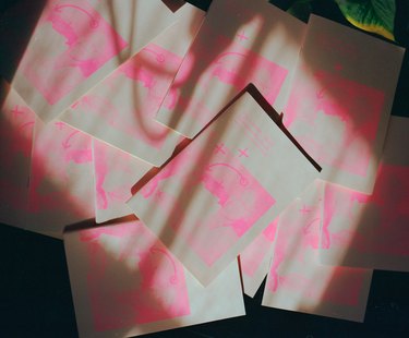 overhead shot of books in pink and beige color