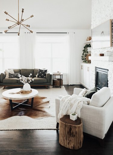 Living room with white walls and dark wood floors.