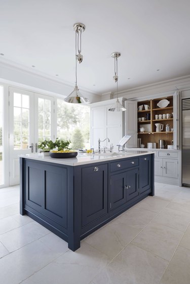 engineered stone kitchen countertops with blue cabinetry