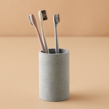 toothbrushes in soapstone tumbler