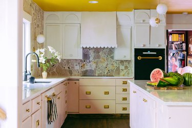pink kitchen with diy broken marble backsplash