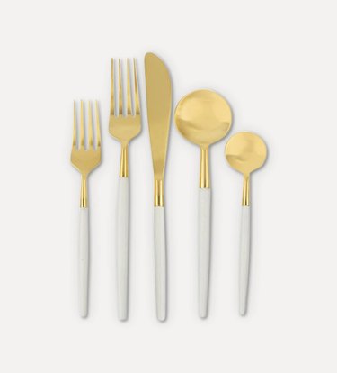 white and gold cutlery
