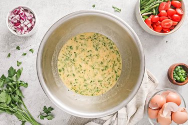 Whisk eggs, heavy cream, spices, and parsley
