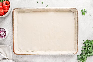 Press dough on to sheet pan