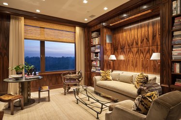 wood paneled room with sofa