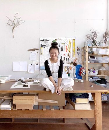 sasinun kladpetch on workbench in art studio