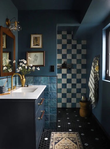 blue bathroom with vintage-inspired light fixtures