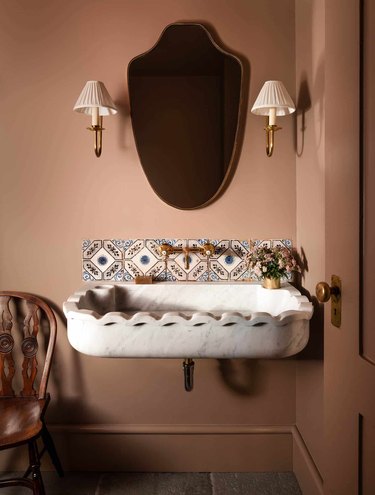 traditional wall sconces in bathroom