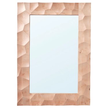 A carved birch vertical wall mirror.