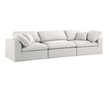 white three-seater sofa