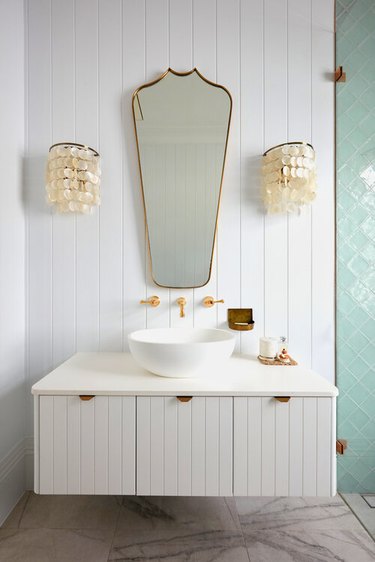 coastal bathroom lighting with capiz shell shades