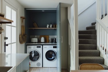 coffee bar with washer and dryer near kitchen