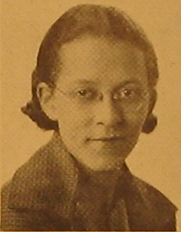 Sepia tone photo of a Black woman wearing glasses