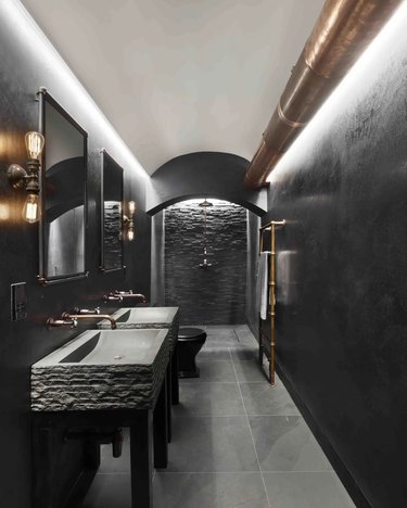 Black and gray narrow basement bathroom