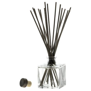 kai reed diffuser in clear glass bottle