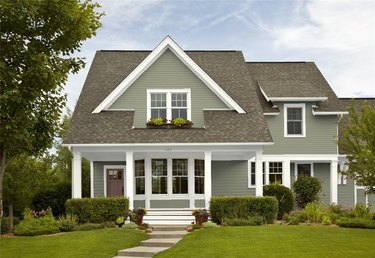 House with brown roof and green exterior paint