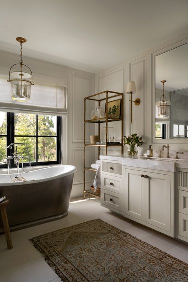 transitional bathroom with reeded drawer fronts and wall molding